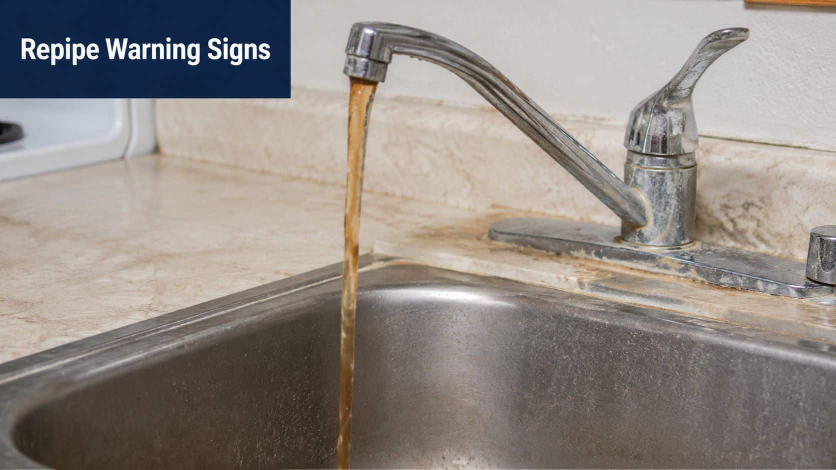 A kitchen faucet running brown, discolored water into a stainless steel sink, indicating plumbing pipe corrosion issues.